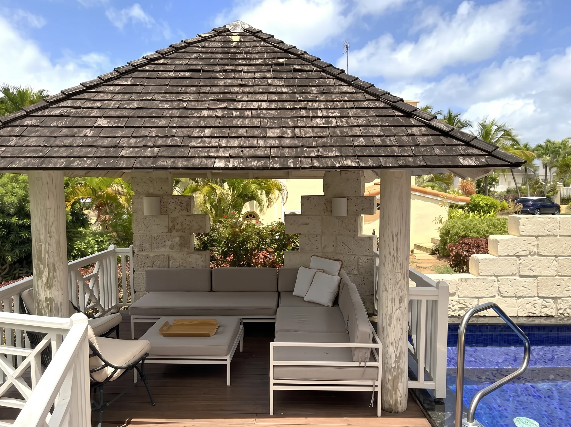 Raised gazebo and outdoor seating at Palm Breeze Villa